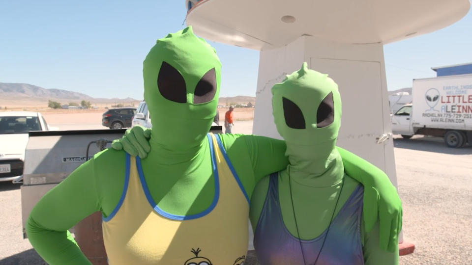 Attendees of Alienstock speak to reporters in Rachel, Nev., ahead of this weekend's gathering of UFO-enthusiasts. (Yahoo News)