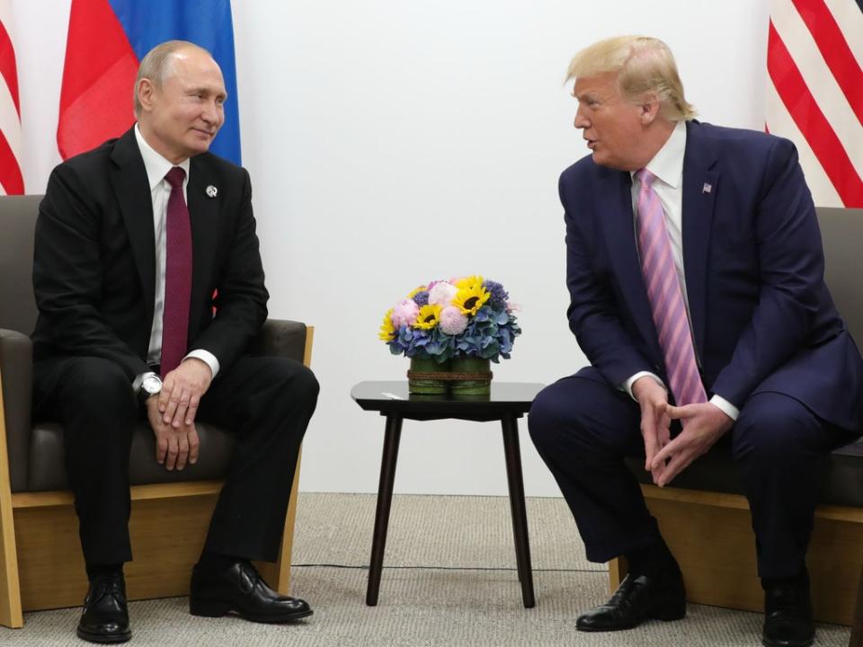 Vladimir Putin and Donald Trump (AFP via Getty Images)