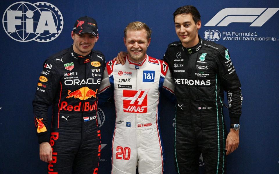 Formula One F1 - Brazilian Grand Prix - Jose Carlos Pace Circuit, Sao Paulo, Brazil - November 11, 2022 Haas' Kevin Magnussen celebrates after qualifying in pole position alongside second placed Red Bull's Max Verstappen and third placed Mercedes' George Russell - Pool via REUTERS/Nelson Almeida