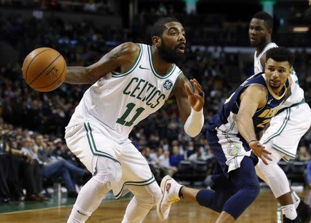 Dec 13, 2017; Boston, MA, USA; Boston Celtics guard Kyrie Irving (11) looks for an opening during the second half of their 124-118 win over the Denver Nuggets at TD Garden. Winslow Townson-USA TODAY Sports