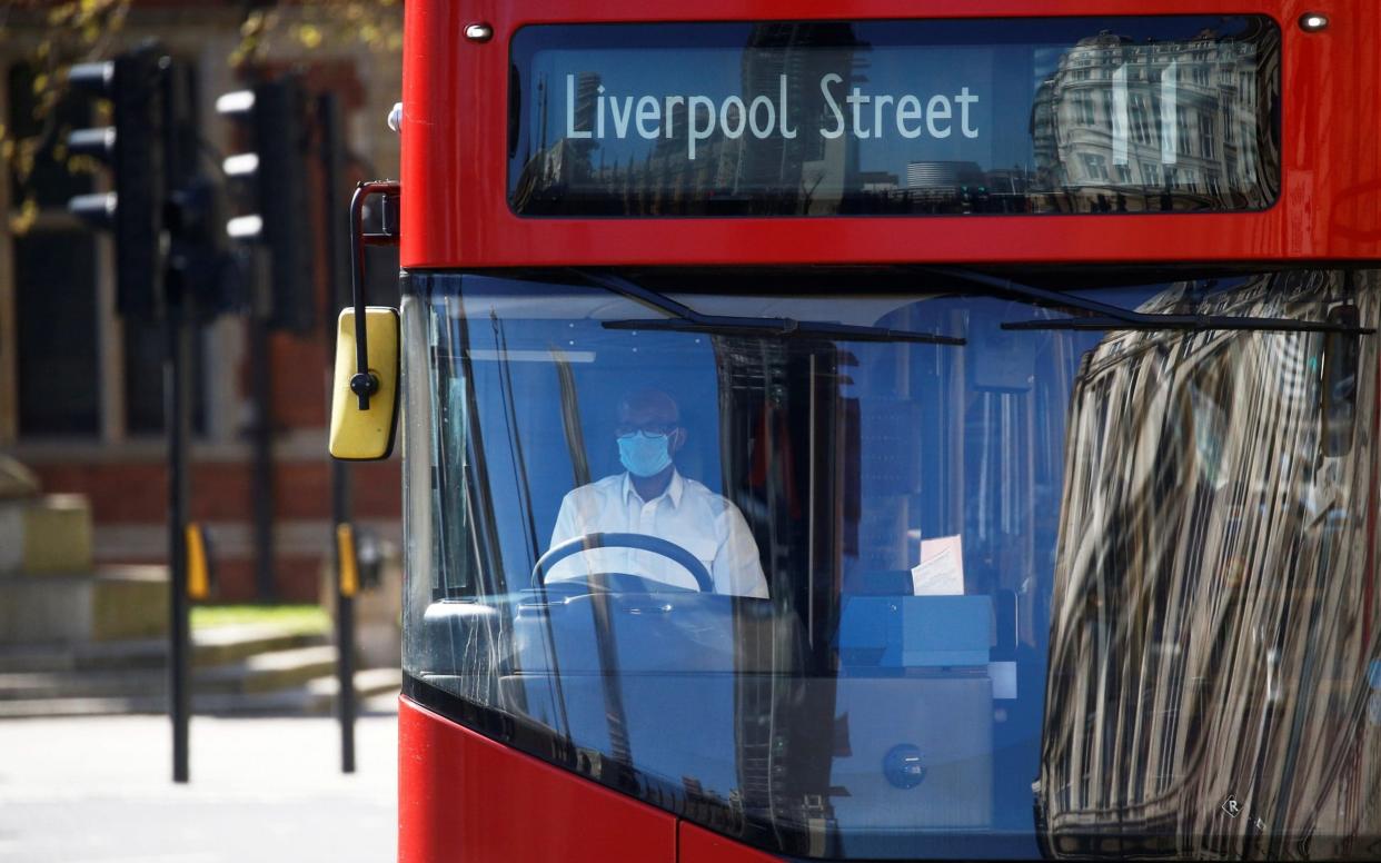 Men are more likely to be in "high contact" occupations such as bus driving - Henry Nicholls/Reuters