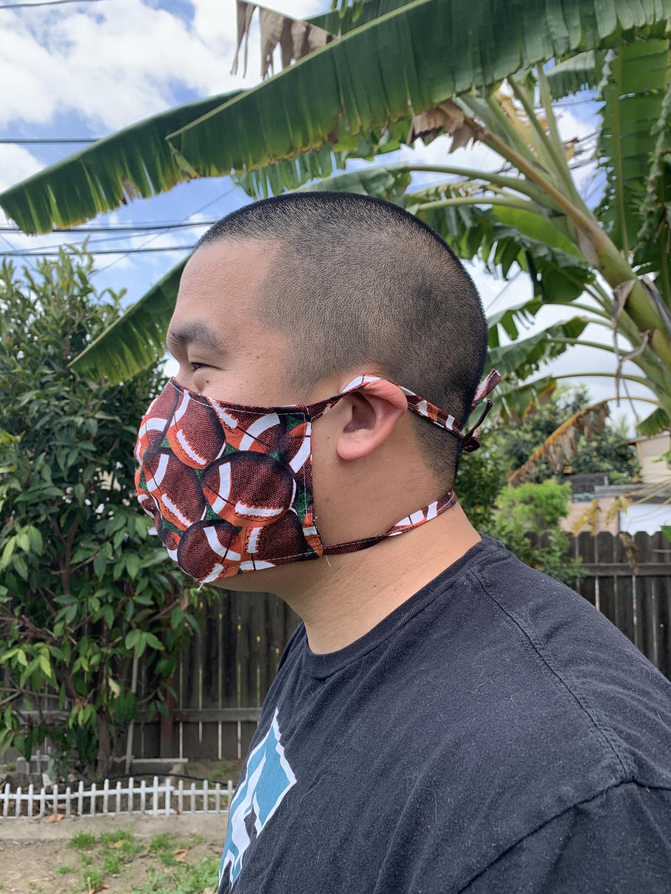 Kevin Pham, Ava Nguyen's boyfriend, wears a mask she made with her mother.  (Ava Nguyen)