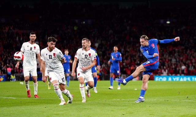 England's Jack Grealish (right) shoots