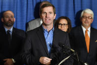 Kentucky Governor-Elect Andy Beshear introduces his transition team in the Capitol Rotunda in Frankfort, Ky., Friday, Nov. 15, 2019. Beshear says it’s time for Kentuckians to come together now that his tough race against Republican Gov. Matt Bevin has concluded. (AP Photo/Timothy D. Easley)