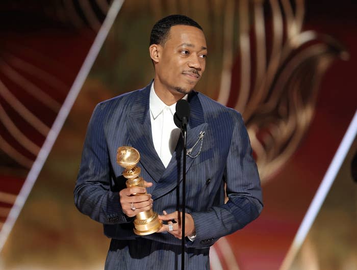 Tyler James Williams accepts the Best Performance by an Actor in a Supporting Role in a Musical-Comedy or Drama Television Series award for Abbott Elementary at the 80th Annual Golden Globe Awards on January 10, 2023, in Beverly Hills, California.