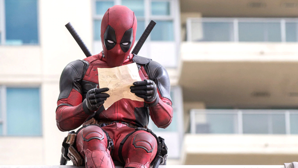 Deadpool is reading a note