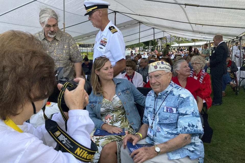 Pearl Harbor survivor Herb Elfring, 100, right, of Jackson, Mich., poses for a photo next to his granddaughter Leigh Anne Eaton before a ceremony on Wednesday, Dec. 7, 2022, in Pearl Harbor, Hawaii in remembrance of those killed in the 1941 attack. A handful of centenarian survivors of the attack on Pearl Harbor gathered at the scene of the Japanese bombing on Wednesday to commemorate those who perished 81 years ago. (AP Photo/Audrey McAvoy)