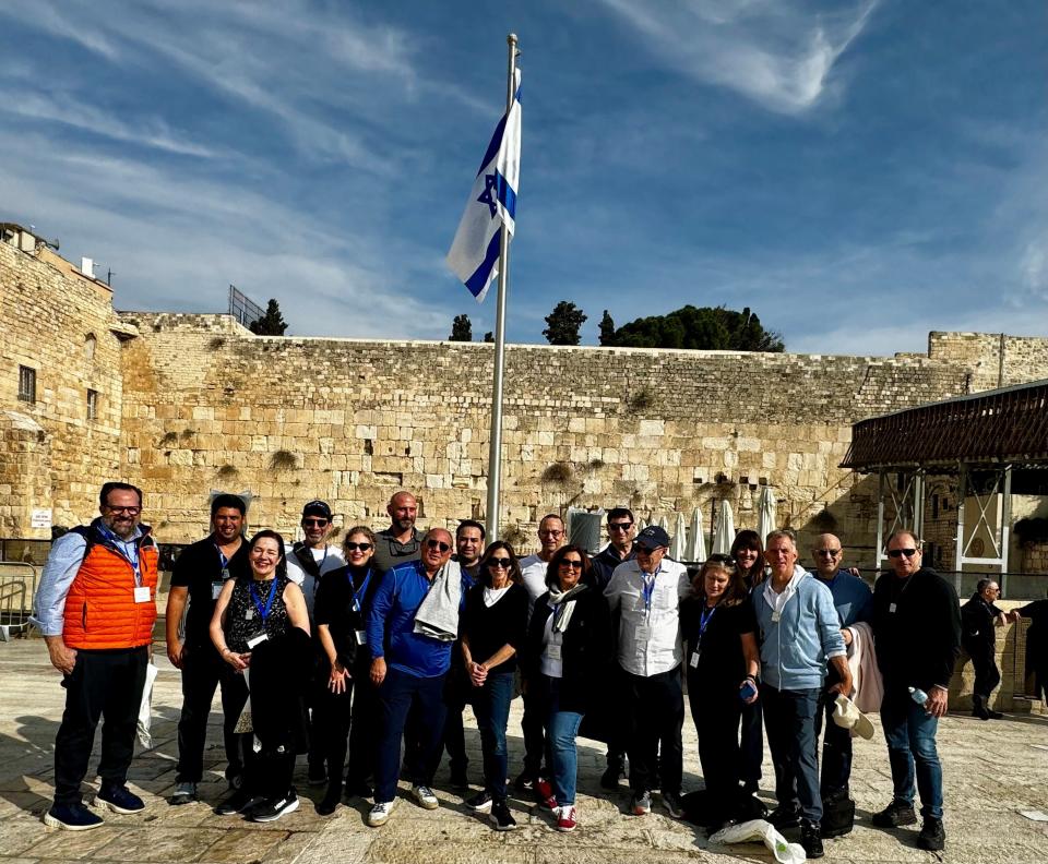 A group of 18 members from Temple Emanu-El in Closter, led by Rabbi David-Seth Kirshner (left) spent a week on a volunteer mission in Israel. They packed food for those displaced by the Hamas attacks, visited families of Hamas hostages and gave gifts to injured soldiers and first responders.