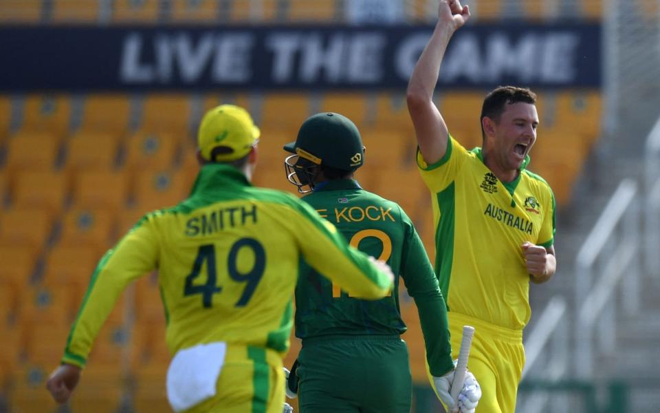 Australia's Josh Hazlewood (R) celebrates with teammates after taking the wicket of South Africa's Quinton de Kock (C) during the ICC mens Twenty20 World Cup cricket match between Australia and South Africa - Getty Images