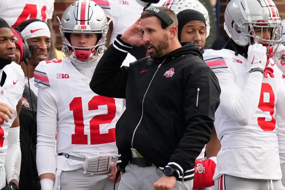 Nov 25, 2023; Ann Arbor, Michigan, USA; Ohio State Buckeyes offensive coordinator Brian Hartline talks on the sideline during the NCAA football game against the Michigan Wolverines at Michigan Stadium. Ohio State lost 30-24.