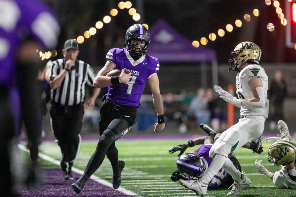 - Jake Merklinger of Calvary runs out of bounds after gaining postive yards Friday night game against Wesleyan.