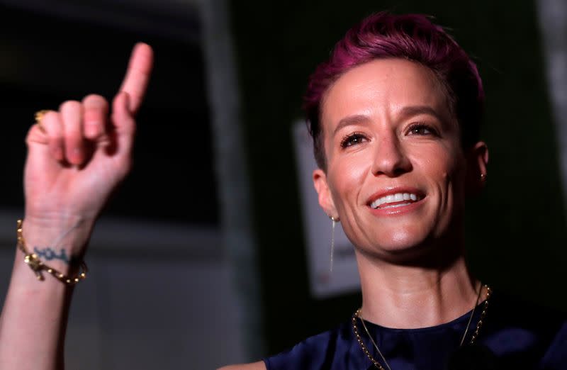 Megan Rapinoe poses as she arrives for Sports Illustrated Sportsperson of the Year Awards in New York