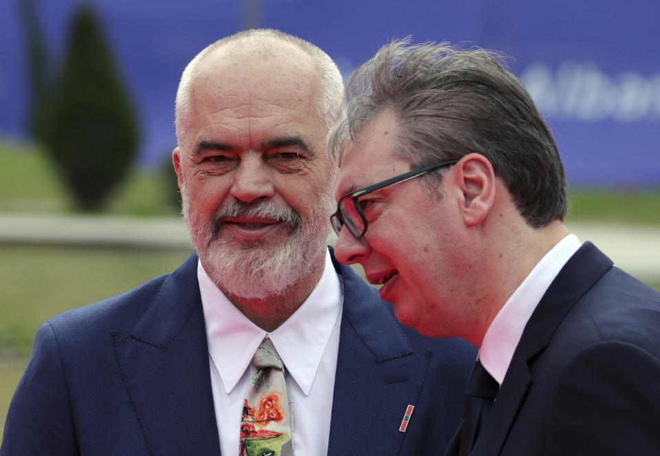 Albania's Prime Minister Edi Rama, left, looks on as Serbia's President Aleksandar Vucic arrives of a summit in Tirana, Albania, Thursday, Feb. 29, 2024. The leaders of Western Balkan countries met Thursday in another joint push to use the European Union's financial support plan of six billion euros (about $6.5 billion) hoping it will speed up its membership in the bloc. (AP Photo/Armando Babani)