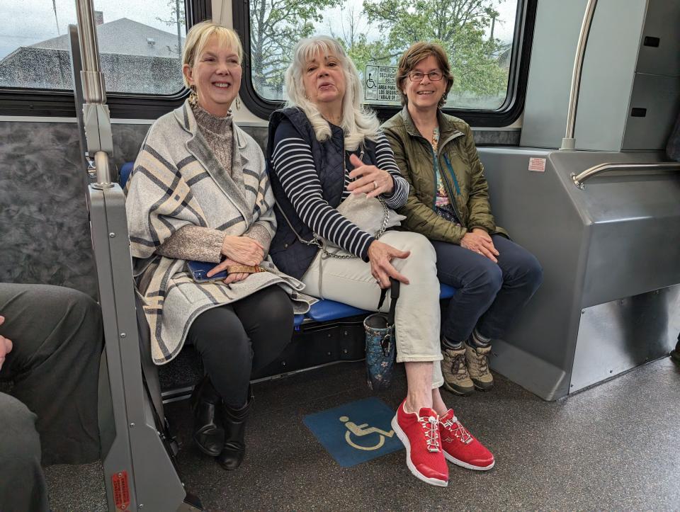 TCAT board Chairperson Deborah Dawson sits between board members Susan Currie and Laura Lewis during a Gillig electric bus test drive April 24, 2024.