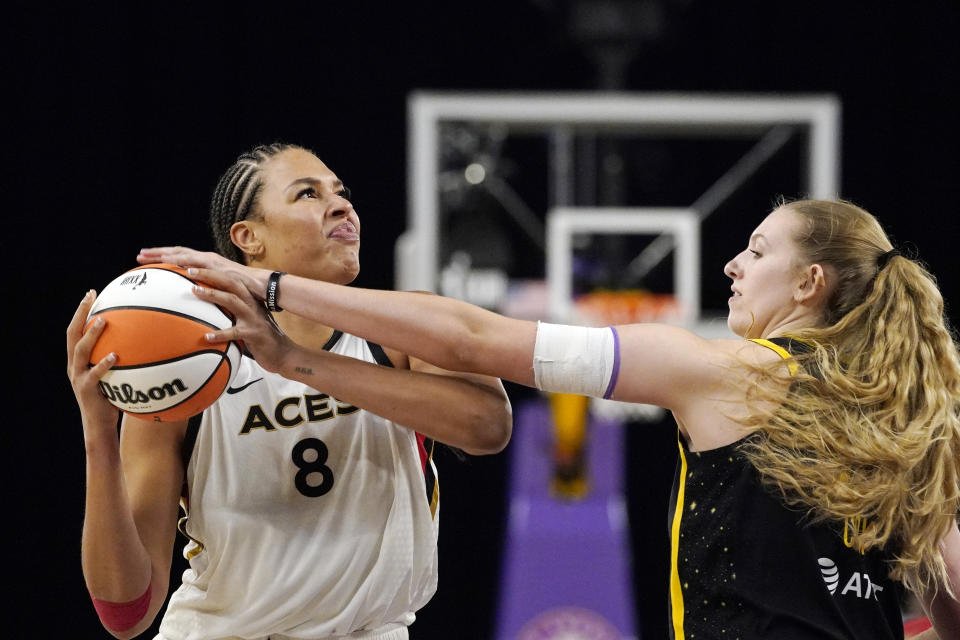 Las Vegas Aces center Liz Cambage, left, tries to shoot as Los Angeles Sparks forward Lauren Cox defends during the second half of a WNBA basketball game Friday, July 2, 2021, in Los Angeles. The Aces won 66-58. (AP Photo/Mark J. Terrill)