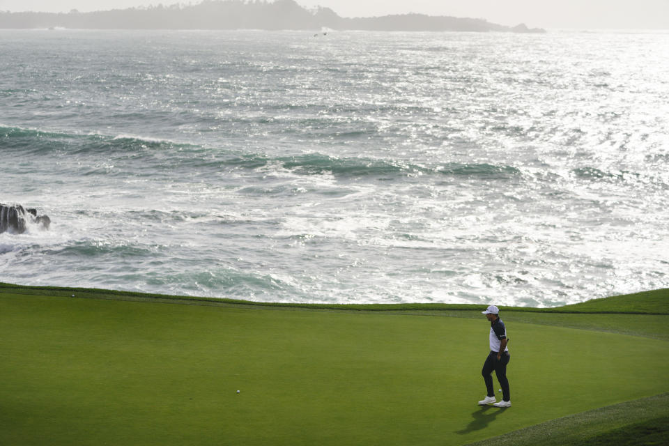 Kurt Kitayama walks on the eighth green on the Pebble Beach Golf Links during the first round of the AT&T Pebble Beach National Pro-Am golf tournament Thursday, Feb. 1, 2024, in Pebble Beach, Calif. (AP Photo/Ryan Sun)