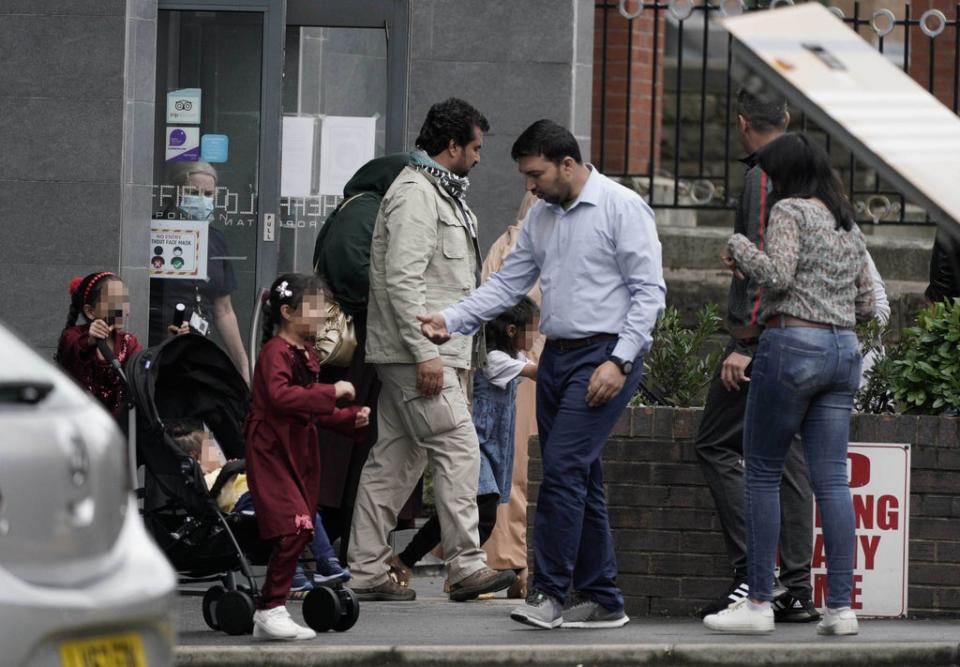 People leave the Sheffield Metropolitan Hotel in Blonk Street, where a five-year-old boy, an Afghan refugee whose family recently fled the Taliban, died after he fell from a window on Wednesday (Peter Byrne/PA) (PA Wire)