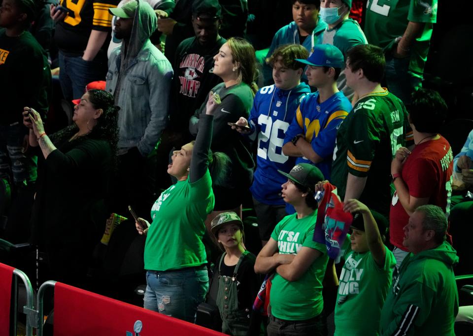 Philadelphia Eagles fans cheer at the Footprint Center in downtown Phoenix during the NFL's Super Bowl Opening Night in February 2023. The cheering ended a few days later when the Eagles lost to the Kansas City Chiefs, 38-35, after being robbed by the refs.
