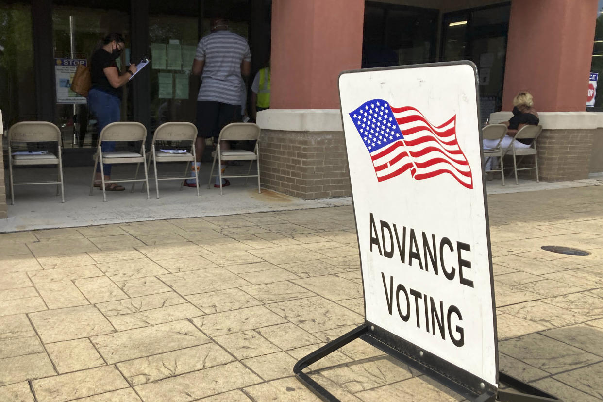 A sign for early voting in Marietta, Ga. on May 19, 2022, during advanced voting. The Georgia primary is Tuesday, May 24. Tuesday's election in Georgia marks the biggest test yet of new voting restrictions enacted by Republicans in one of the nation's most important battleground states as voters decide hotly contested primary races for governor and U.S. Senate. (AP Photo/Mike Stewart, File)