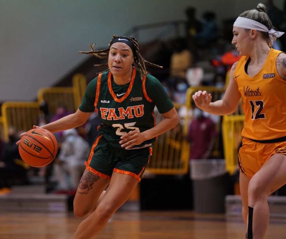 FAMU guard Caylan Jones looks to drive by Tayum Hayes (12) of Bethune-Cookman during a game on Monday, Jan. 3, 2021. The Rattlers defeated the Wildcats 70-68.