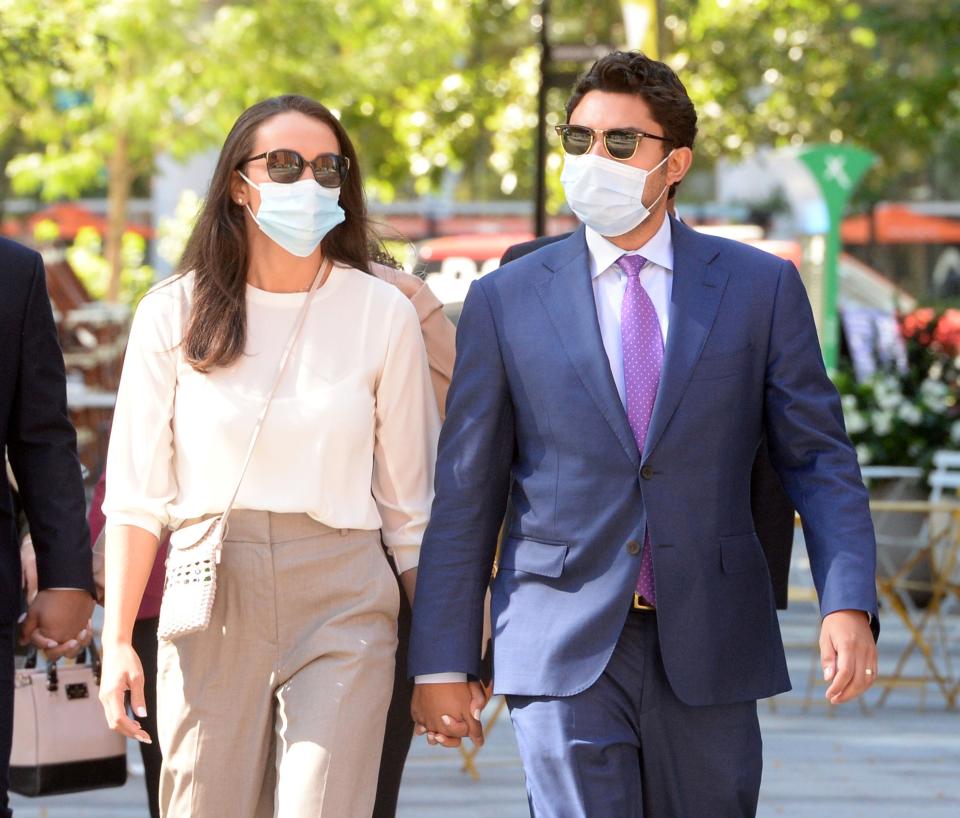 Former Fall River Mayor Jasiel Correia II and his wife, Jenny Fernandes Correia, enter John Joseph Moakley Federal Courthouse in Boston in September 2021.