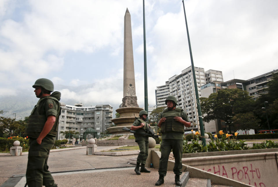 Bolivarian National Guards patrol Plaza Altamira in Caracas, Venezuela, Monday, March 17, 2014. Security forces on Monday took control of the plaza that has been at the heart of anti-government protests that have shaken Venezuela for a month. (AP Photo/Esteban Felix)