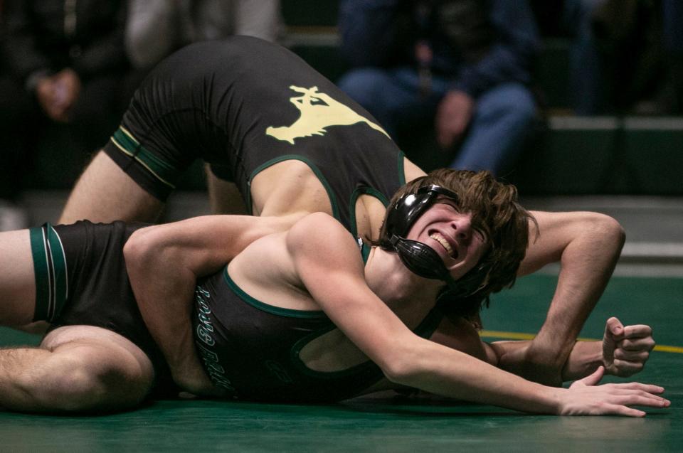 Brick Memorial's Tommy Prince (top) recorded a key 7-0 win over Devon Smith in the Mustangs' 39-30 win over Long Branch Monday night in a NJSIAA Central Group 4 semifinal.