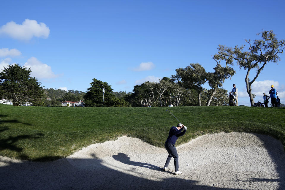 Patrick Cantlay hits from a bunker toward the 16th green at Pebble Beach Golf Links during the second round of the AT&T Pebble Beach National Pro-Am golf tournament in Pebble Beach, Calif., Friday, Feb. 2, 2024. (AP Photo/Ryan Sun)