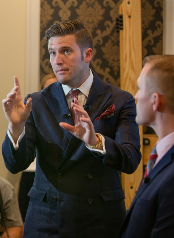 White nationalist Richard Spencer (L) and Nathan Damigo of Identity Evropa speak to select media in Alexandria, Virginia, on August 14, 2017