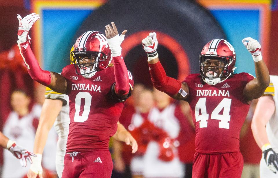 Indiana's Dasan McCullough (0) and Aaron Casey (44) celebrate McCullough's sack of Idaho's Gevani McCoy (4) during the Indiana versus Idaho football game at Memorial Stadium on Saturday, Sept. 10, 2022.