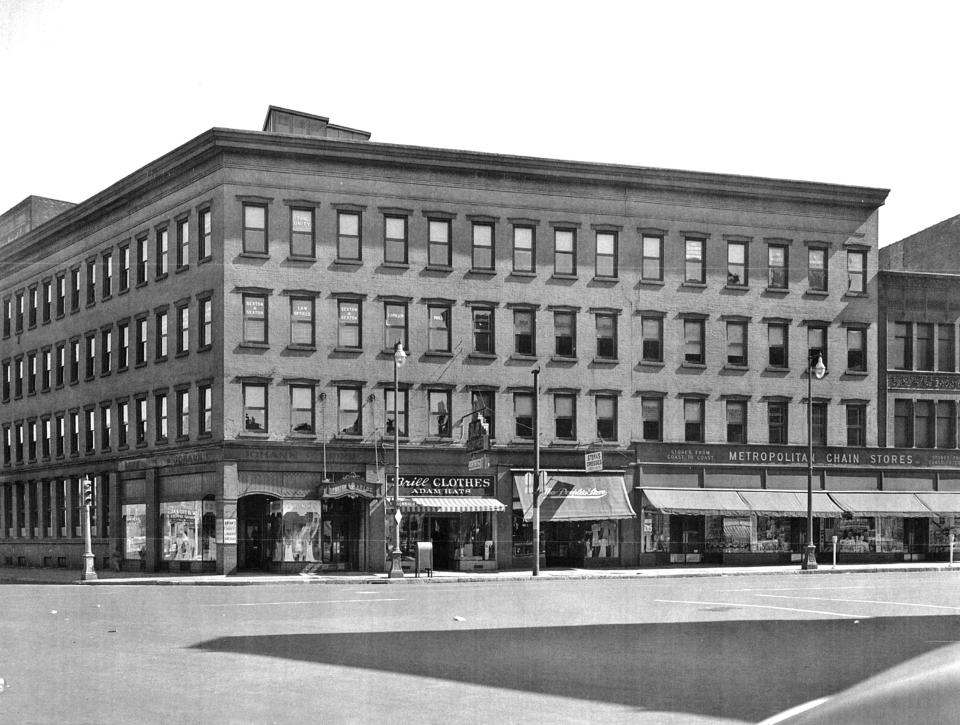 By 1925, the Foster Building had stood for more than 50 years on the southeast corner of Genesee Street and the Erie Canal in downtown Utica. Then the canal was abandoned, filled in, paved and named Oriskany Street. That meant that the north side of the building (on the left) now faced speedy motor vehicles instead of slow-moving canal boats. Business at stores on the building’s ground floor dropped and eventually the building was torn down. It had been built in the mid-19th century by Thomas Foster. At one time, the building’s top floor offices were the homes of doctors, lawyers and the state Department of Labor. In the second half of the 20th century, the site was occupied by the Boston Store, the area’s largest department store.