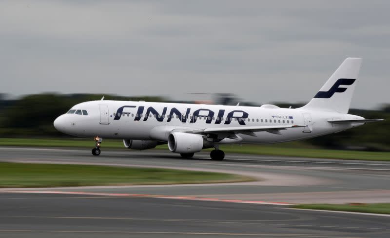 FILE PHOTO: A Finnair Airbus A320 aircraft prepares to take off from Manchester Airport in Manchester