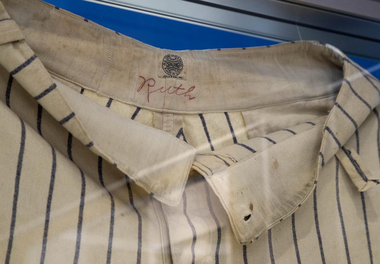 A uniform jersey worn by New York Yankees slugger Babe Ruth is on display at The Avron B. Fogelman Sports History Museum at FAU. [ALLEN EYESTONE/palmbeachpost.com]
