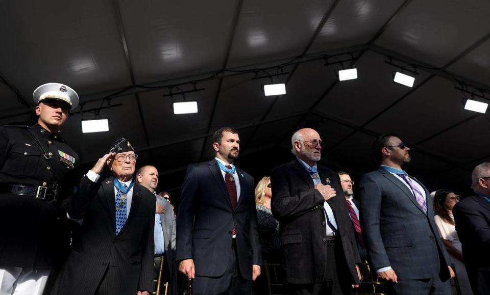 Medal of Honor recipients stand for the national anthem during the groundbreaking ceremony for the National Medal of Honor Museum in Arlington on Friday.