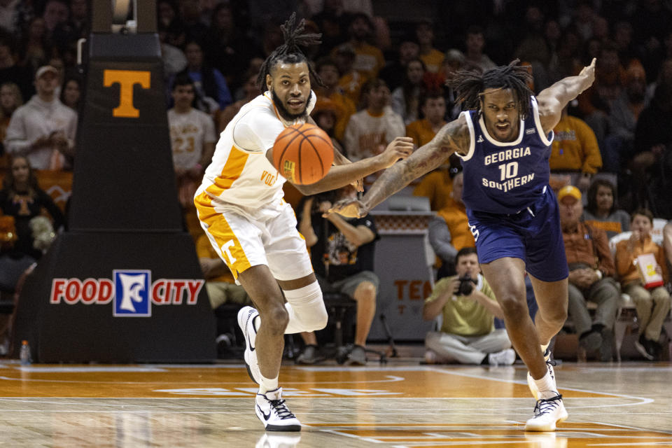 Tennessee forward Jonas Aidoo battles for the ball with Georgia Southern center Carlos Curry (10) during the first half of an NCAA college basketball game, Tuesday, Dec. 12, 2023, in Knoxville, Tenn. (AP Photo/Wade Payne)