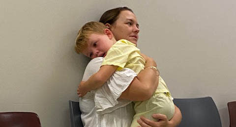 A photo of Candis holding Knox at their last MRI appointment. Source: supplied 