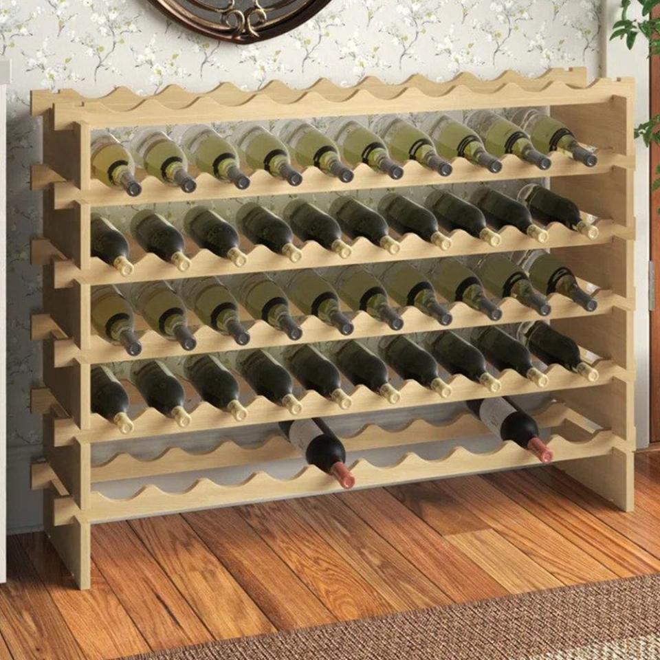 <p><a href="https://go.redirectingat.com?id=74968X1596630&url=https%3A%2F%2Fwww.wayfair.com%2F--%2Fpdp%2Fandover-mills%25e2%2584%25a2--avant-60-bottle-solid-wood-floor-wine-bottle-rack-in-natural-wood-x114202728-l58-w003191617.html&sref=https%3A%2F%2Fwww.bestproducts.com%2Fhome%2Fcleaning-organizing%2Fg44273555%2Fbest-wine-racks%2F" rel="nofollow noopener" target="_blank" data-ylk="slk:Shop Now;elm:context_link;itc:0;sec:content-canvas" class="link ">Shop Now</a></p><p>Avant Solid Wood Floor Wine Bottle Rack</p><p>$67.99</p><p>wayfair.com</p>
