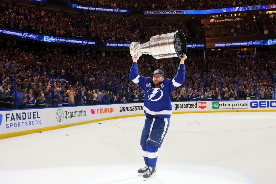 Tampa Bay Lightning center Steven Stamkos hoists the Stanley Cup after a 1-0 victory against the Montreal Canadiens in Game 5.