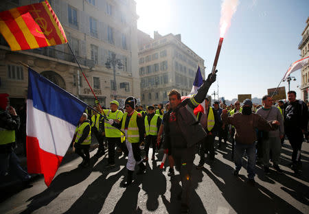 Protesters wearing yellow vests take part in a demonstration of the "yellow vests" movement in Marseille, France, February 23, 2019. REUTERS/Jean-Paul Pelissier