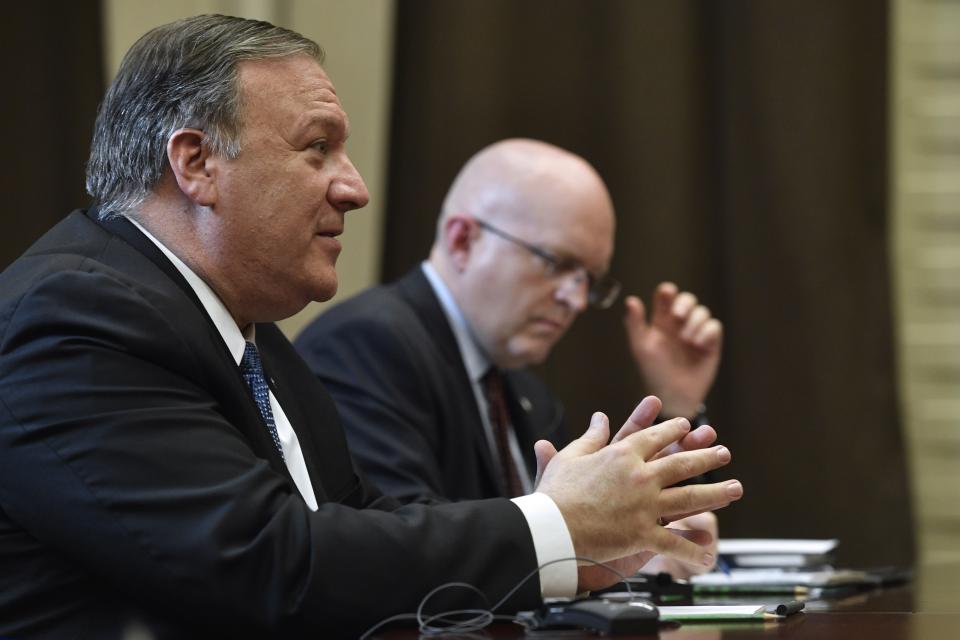 U.S. Secretary of State Mike Pompeo, left, speaks to Russian President Vladimir Putin during their talks in the Black Sea resort city of Sochi, southern Russia, Tuesday, May 14, 2019. Pompeo arrived in Russia for talks that are expected to focus on an array of issues including arms control and Iran. (Alexander Nemenov/Pool Photo via AP)