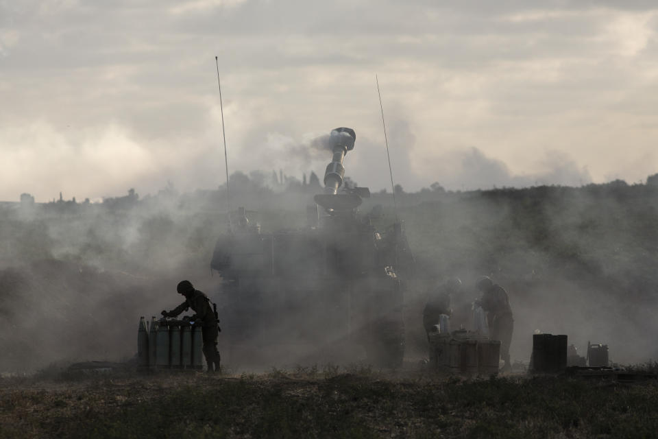 An Israeli artillery unit at the Israeli-Gaza border fires toward targets in the Gaza Strip, on Monday, May 17, 2021. (AP Photo/Heidi Levine)