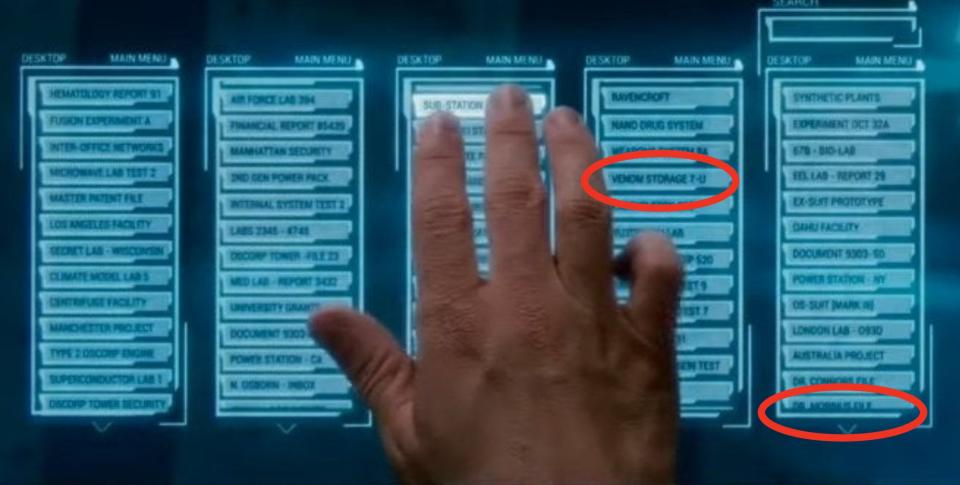 Harry looking through his father's secret files on a computer touch screen in "The Amazing Spider-Man 2"