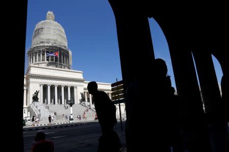 People walk in front of Cuba's Capitol, or El Capitolio, in Havana, Cuba, July 21, 2018. REUTERS/ Stringer