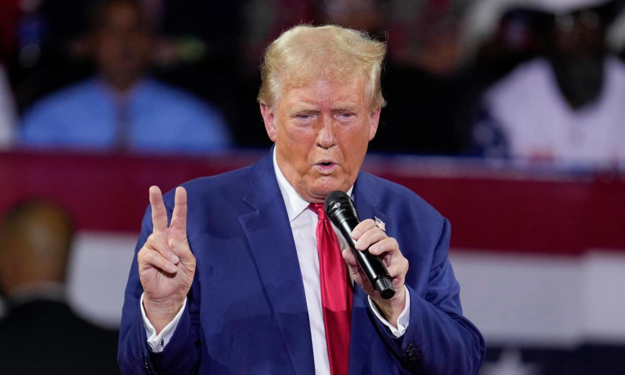 <span>Donald Trump speaks at the town hall in Flint, Michigan, on Tuesday.</span><span>Photograph: Paul Sancya/AP</span>