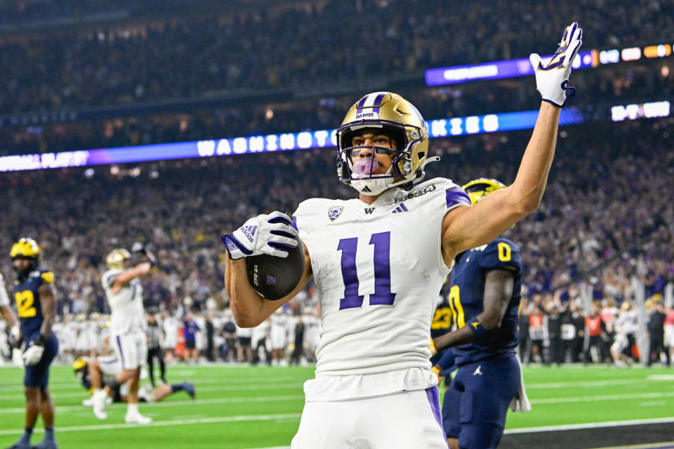 HOUSTON, TX - JANUARY 08: Washington Huskies wide receiver Jalen McMillan (11) celebrates a touchdown reception during the CFP National Championship football game between the Washington Huskies and Michigan Wolverines at NRG Stadium on January 8, 2024 in Houston, Texas. (Photo by Ken Murray/Icon Sportswire via Getty Images)