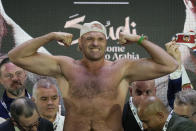 Heavyweight boxer Britain's Tyson Fury poses as he stands on the scales during the weigh-in in Riyadh, Saudi Arabia, Friday, May 17, 2024, prior to his undisputed heavyweight championship fight against Ukraine's Oleksandr Usyk on Saturday. (AP Photo/Francisco Seco)