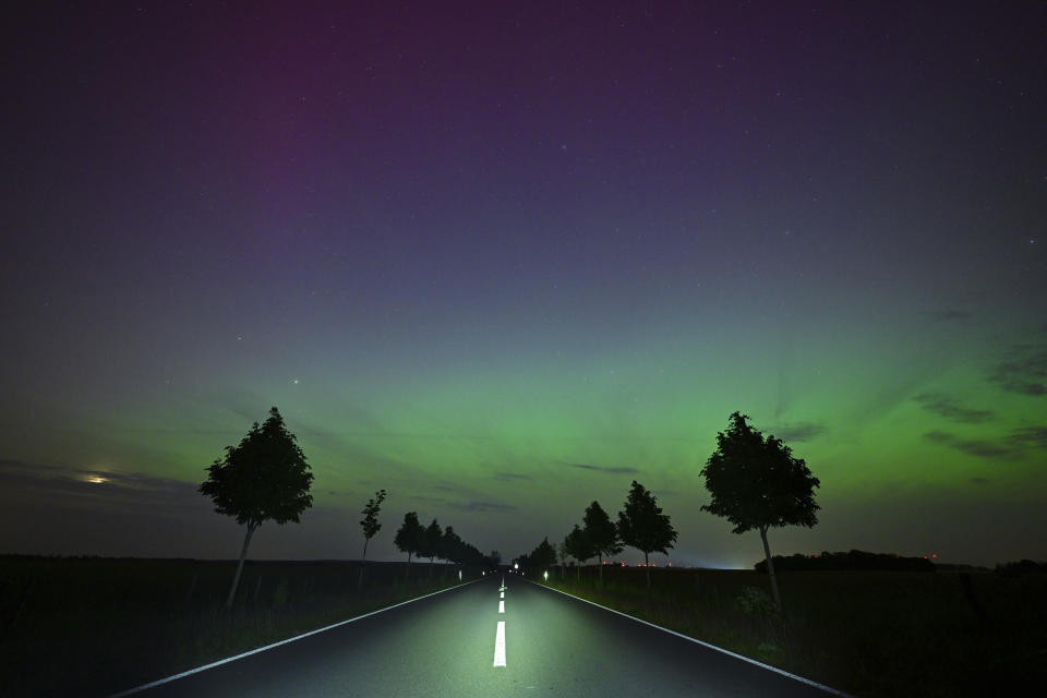 The Northern Lights appear in the night sky over East Brandenburg, Friday, May 10, 2024. Brilliant purple, green, yellow and pink hues of the Northern Lights were reported worldwide, with sightings in Germany, Switzerland, London, and the United States and Canada. (Patrick Pleul/dpa via AP)
