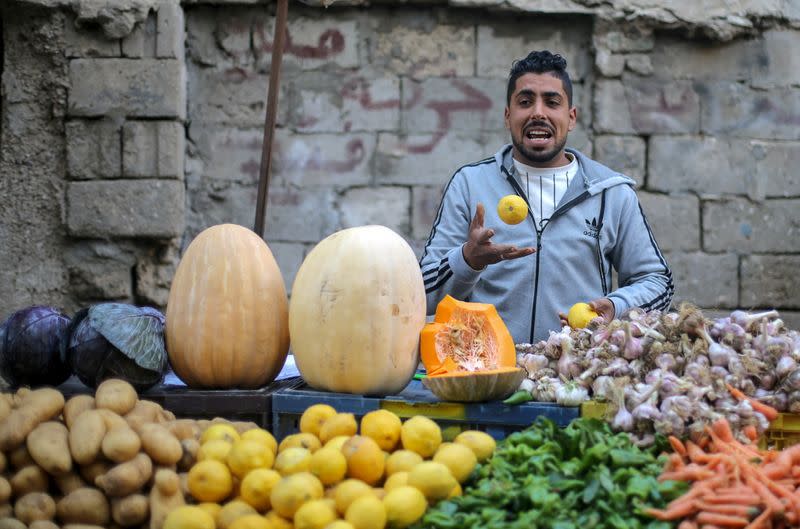 A Palestinian man sells vegetables in Khan Younis in the southern Gaza Strip