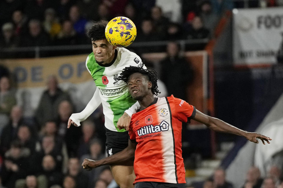 Liverpool's Luis Diaz heads the ball to score his side's first goal during the English Premier League soccer match between Luton Town and Liverpool, at Kenilworth Road, in Luton, England, Sunday, Nov. 5, 2023. (Alastair Grant)