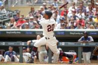 Jun 23, 2018; Minneapolis, MN, USA; Minnesota Twins left fielder Eddie Rosario (20) watches as his two run homer against the Texas Rangers goes over the wall in the first inning at Target Field. Mandatory Credit: Bruce Kluckhohn-USA TODAY Sports